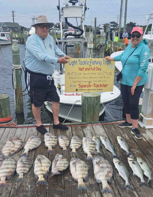 Susan and Allen standing with there day's catch back at the marina.