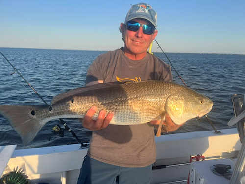 Missphitty soundside angler with a nice red drum.