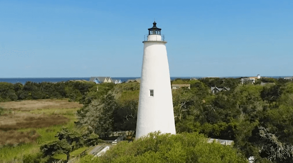 aerial view of White Light house with ocean in background 
